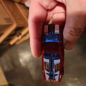 Red and White Toy Car with Blue Star